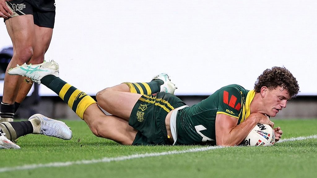 Jack Bostock, wearing Australian green and gold, touches the ball down for a try at the Rugby League World Cup 2026